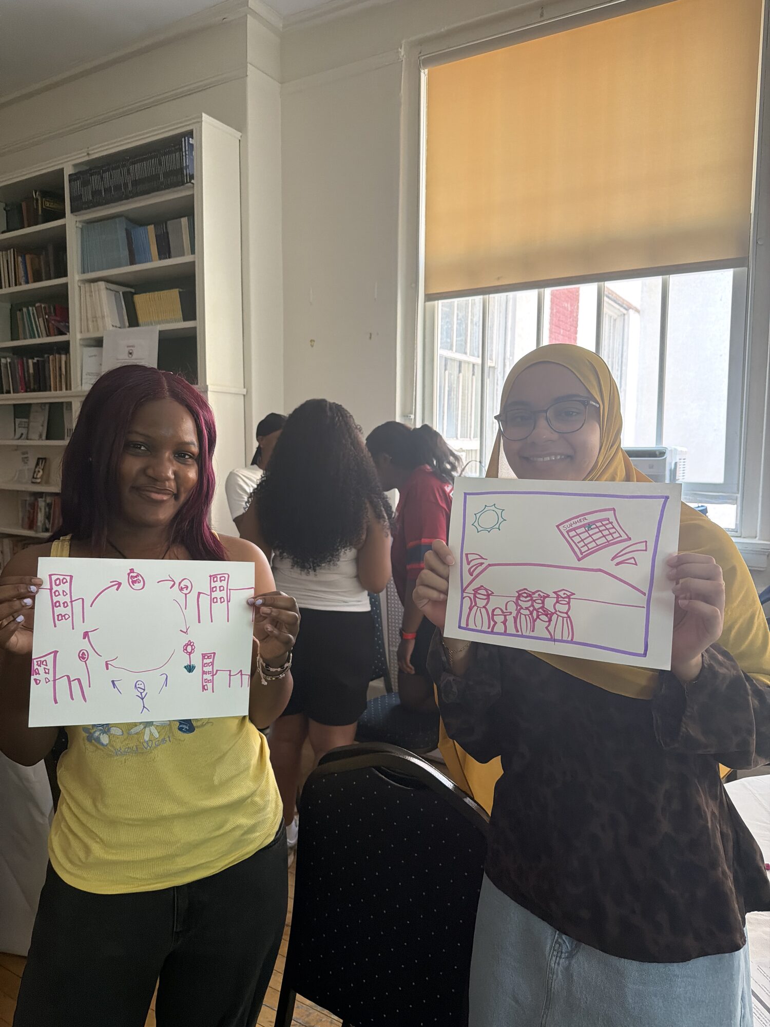 Participants holding up their storytelling exercises